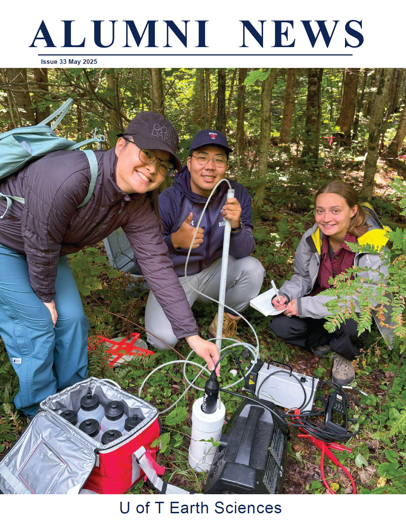 magazine cover with photo of three students using water testing equipment in a forest setting