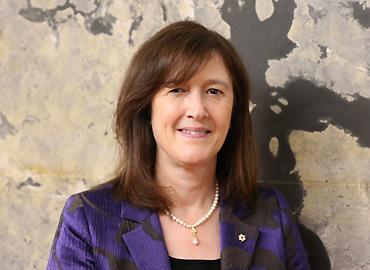 Barbara Sherwood Lollar standing in front of a map